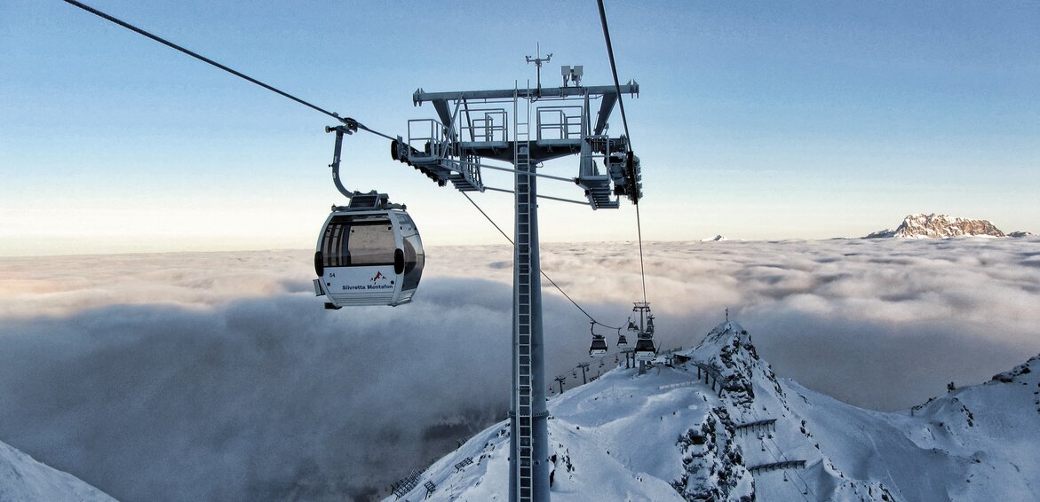 Panorama Bahn - Silvretta Montafon | © Silvretta Montafon Eine Bahn schwebt auf den Berg hoch in wunderschöner Winterlandschaft in der Silvretta Montafon | © Silvretta Montafon